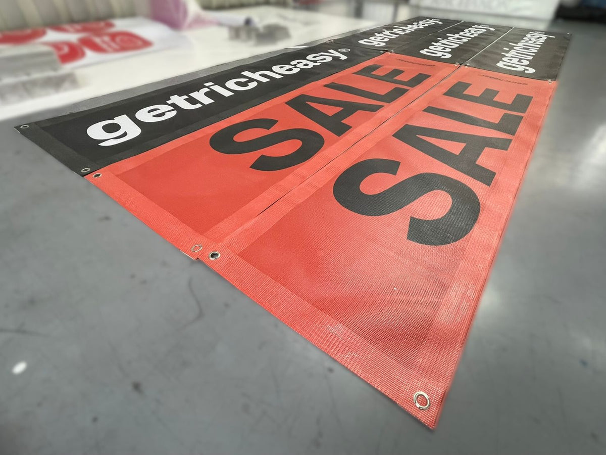 ป้ายไวนิลตาข่ายสีส้มดำแบนเนอร์ลดราคาผ้า mesh ทนทาน