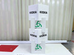 กล่องลูกเต๋า Kioxia สีขาวทรงสแต็ค พิมพ์โลโก้เขียวและ Taj Association