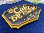 ป้ายร้าน Cafe De Canal วัสดุ Plaswood ทาสีพ่นทอง ขอบหลายชั้น