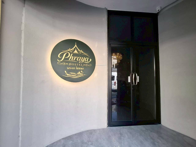Halo-lit zinc die-cut logo sign circular 90cm standoff mount outdoor LED installation