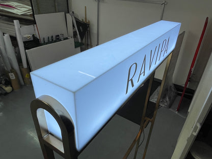 Acrylic light box, lights around the sign, attached from the wall