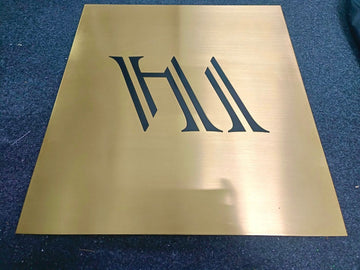 Brass sign, etched and painted.