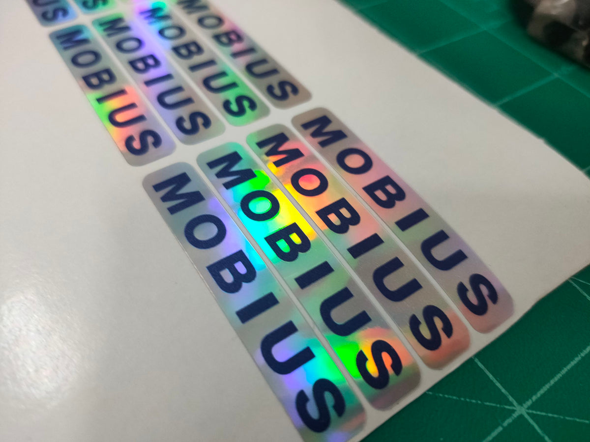 สติ๊กเกอร์โฮโลแกรม Hologram Sticker กันปลอม สะท้อนแสงหลากสี เพิ่มมูลค่าแบรนด์ เหมาะสำหรับฉลากสินค้า และงานพรีเมียม