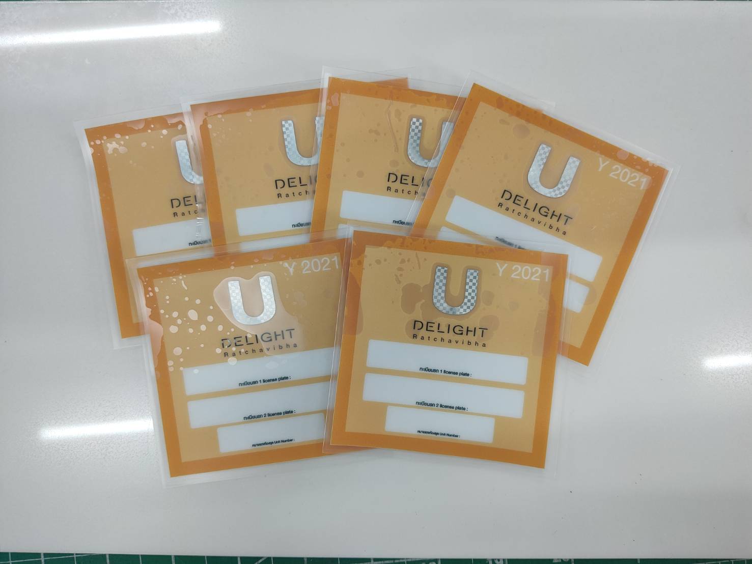 สติ๊กเกอร์สูญญากาศ ติดกระจกรถ เข้า-ออกหมู่บ้าน - Octopus Media Solutions