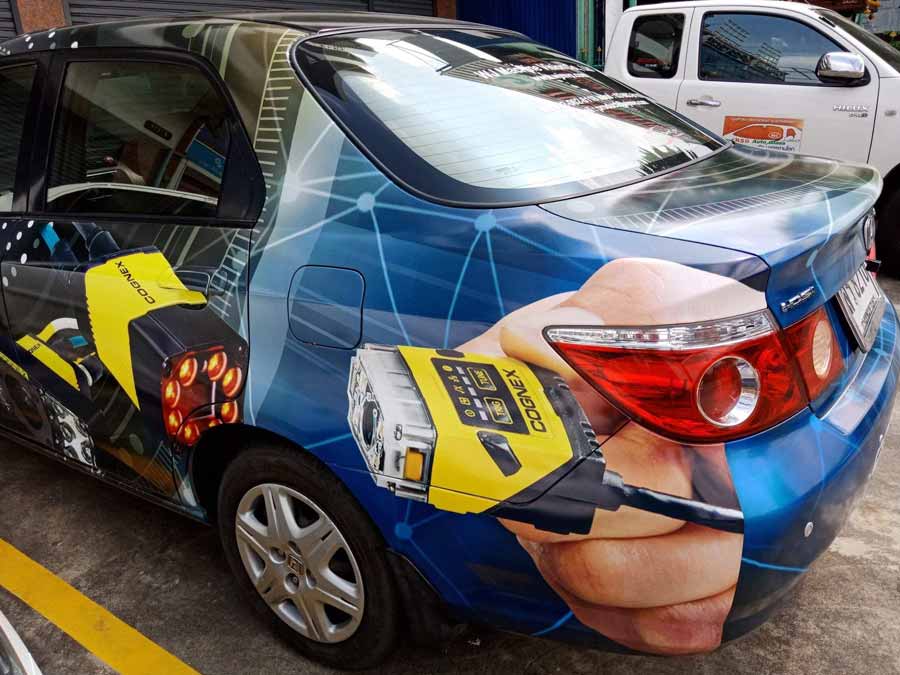 สติ๊กเกอร์ติดรถ Car Wrap แร็ปสติ๊กเกอร์ วัสดุคุณภาพสูง 3M พิมพ์คมชัด ติดทนทาน เหมาะสำหรับโฆษณาและตกแต่งรถทุกประเภท