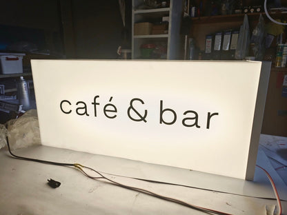 Acrylic light box, lights around the sign, attached from the wall