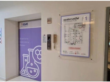 Clear acrylic sign with picture attached.