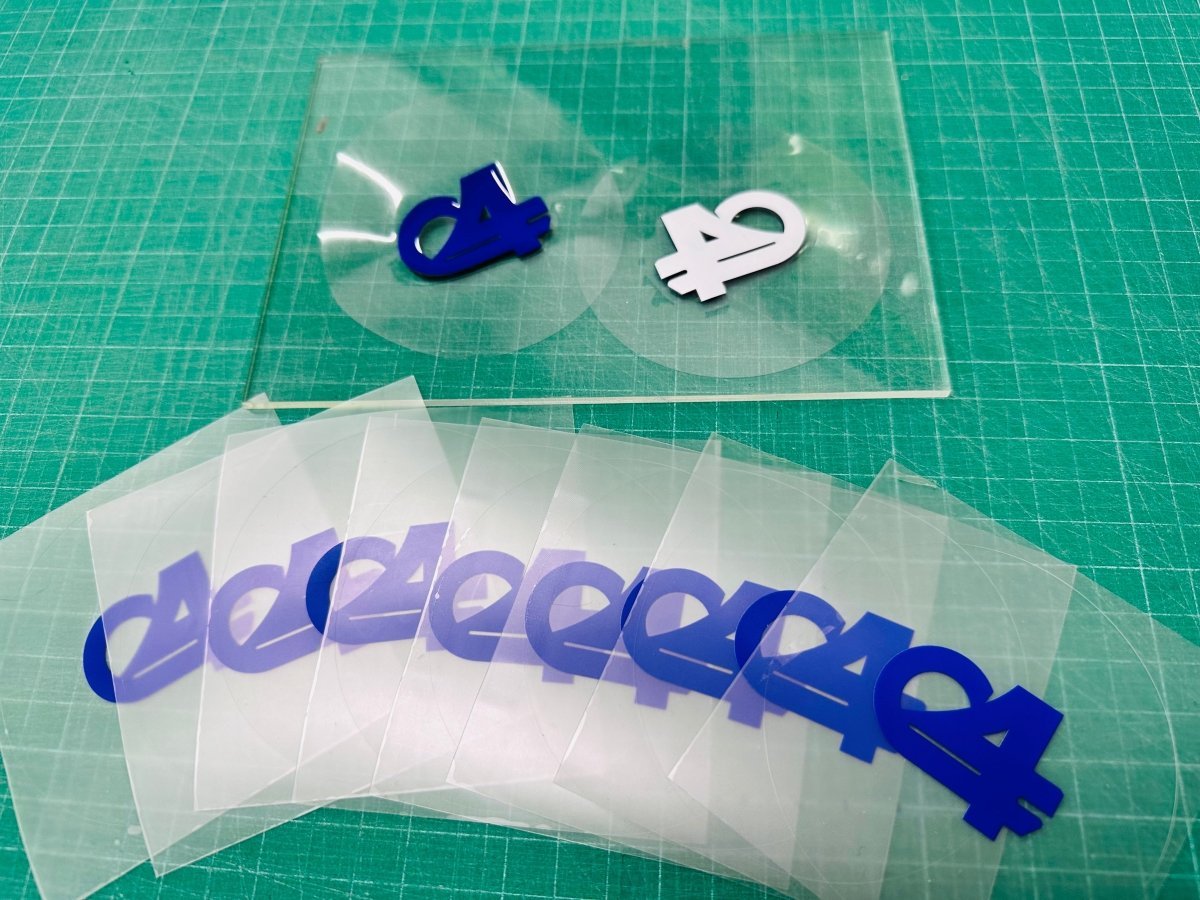 สติ๊กเกอร์สูญญากาศ ติดกระจกรถ เข้า-ออกหมู่บ้าน - Octopus Media Solutions